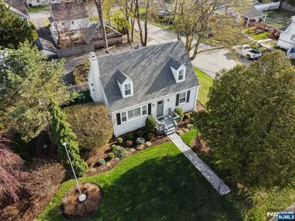 an aerial view of a house with a yard