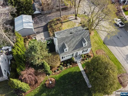 a view of a backyard with chairs
