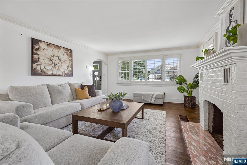 122 Johnson Avenue Mahwah, NJ 07430 - Photo 5 of 40 a living room with furniture a large window and a fireplace