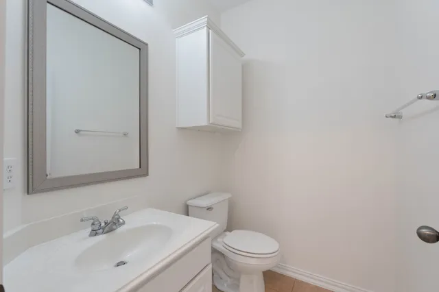 a bathroom with a sink vanity and mirror