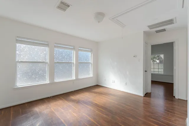 a bathroom with a toilet sink and a mirror