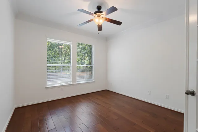 a view of a balcony with wooden floor