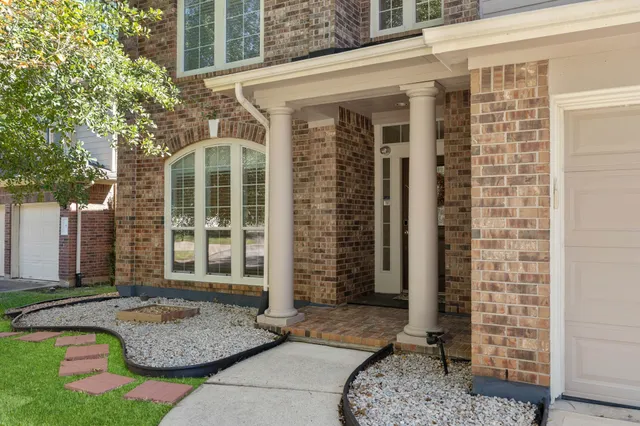 a front view of a house with a porch