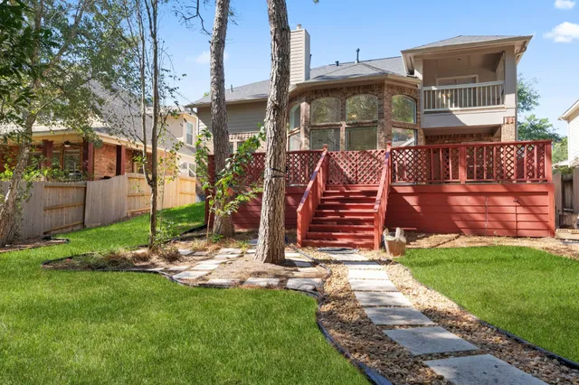 a view of a park with a slide and a table and chairs