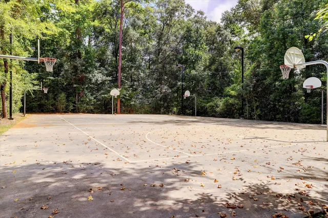 a view of a backyard with sitting area