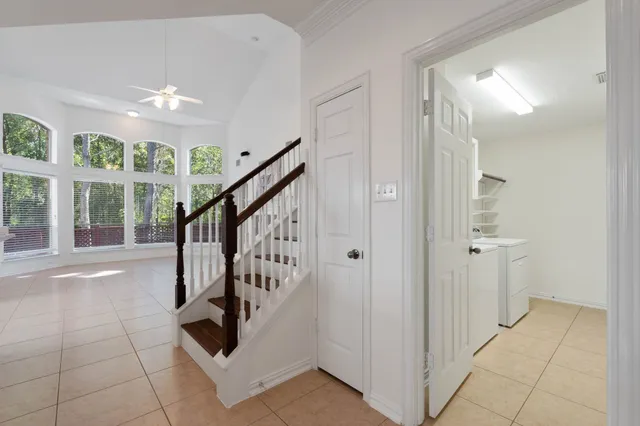 a view of entryway with stairs and wooden floor
