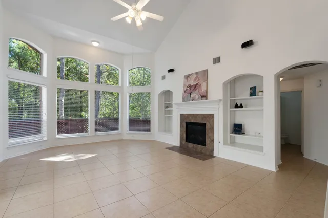 a view of a livingroom with an empty space and a fireplace