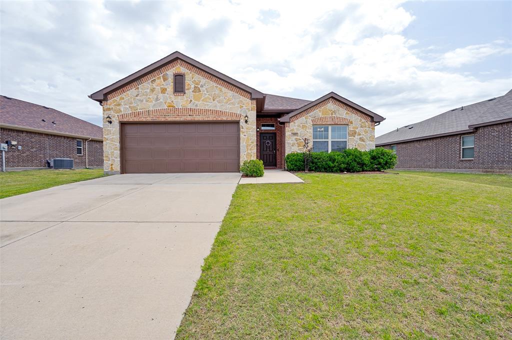3905 Bridle Path Lane Sanger, TX 76266 - Photo 1 of 26 a front view of a house with yard and garage