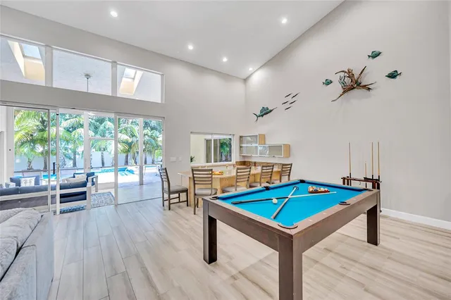 a living room with hard wood floors and a table