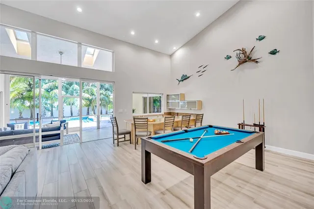a living room with hard wood floors and a table