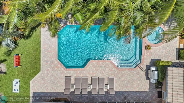a view of swimming pool with outdoor seating