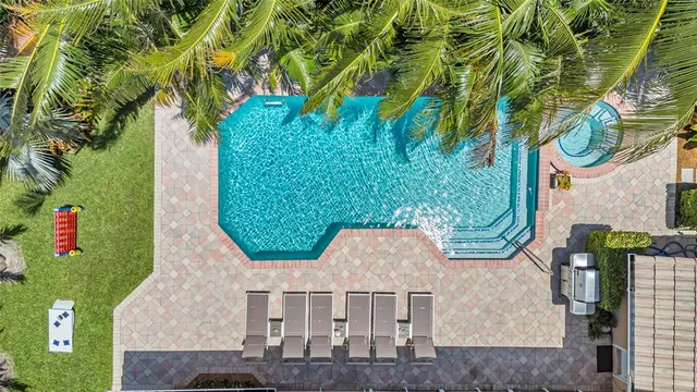 a view of swimming pool with outdoor seating