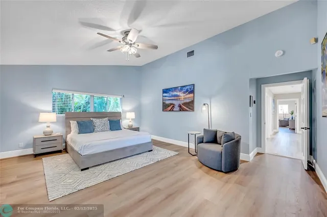 a spacious bedroom with a bed and furniture