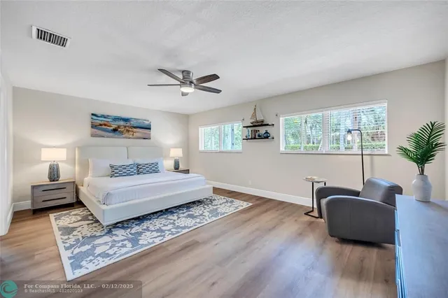 a bedroom with furniture and a window