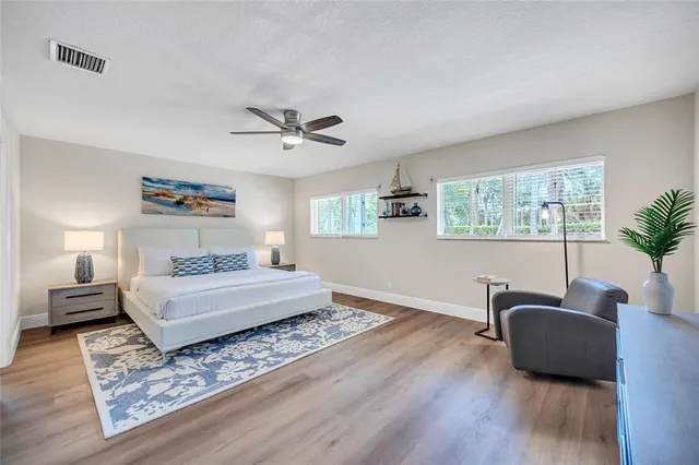 a bedroom with furniture and a window