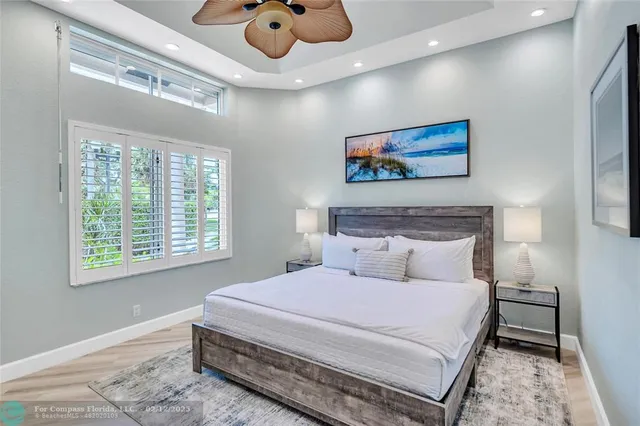 a bedroom with a bed and glass window