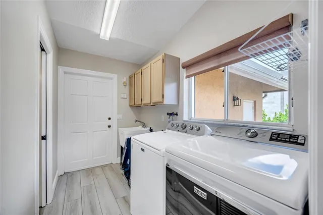 a view of backyard with swimming pool