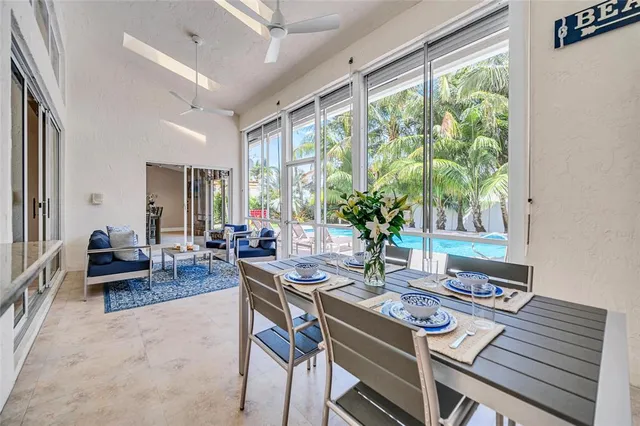 a spacious bedroom with a bed and a flat screen television