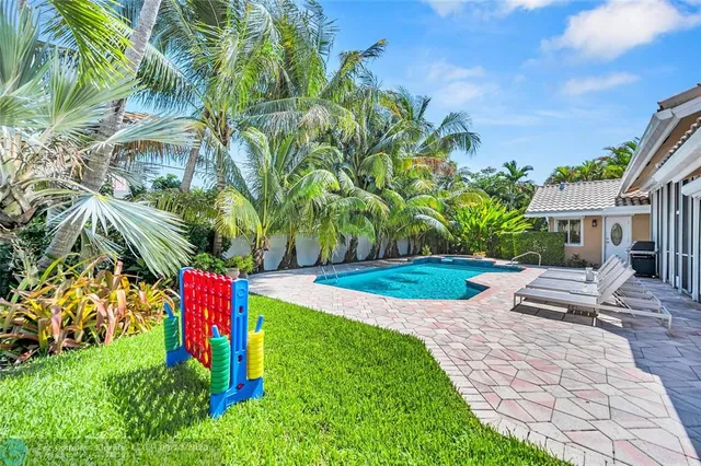 a view of a swimming pool with chairs
