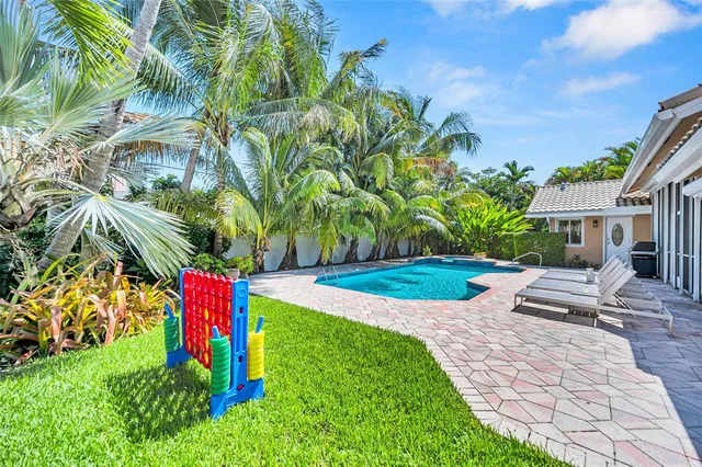 a view of a swimming pool with chairs