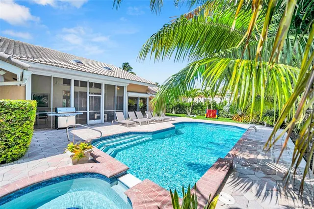a view of a swimming pool with chairs
