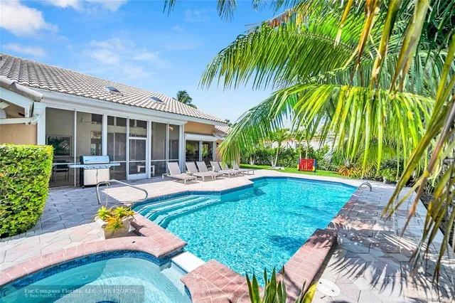a view of a swimming pool with chairs