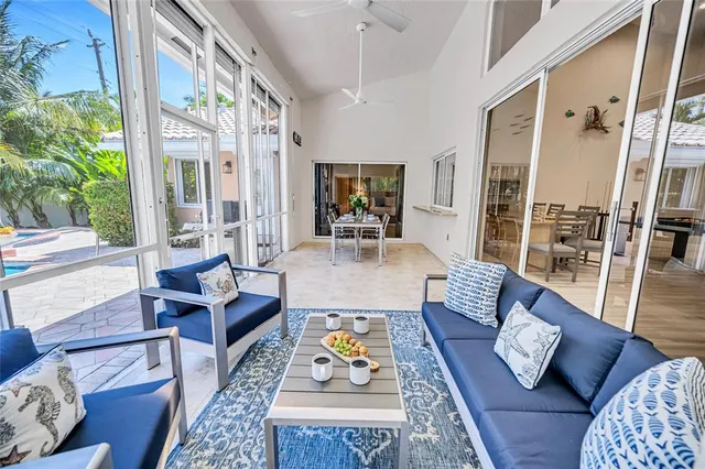 a dining room with furniture a window and wooden floor