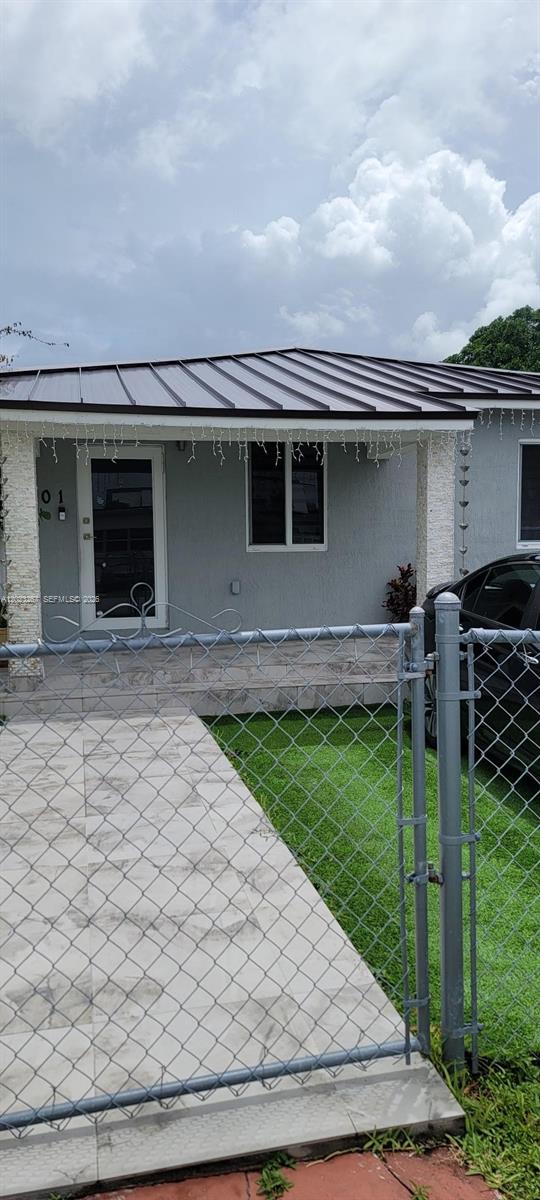 301 Southwest 36th Avenue Miami, FL 33135 - Photo 3 of 32 front view of a house with a yard
