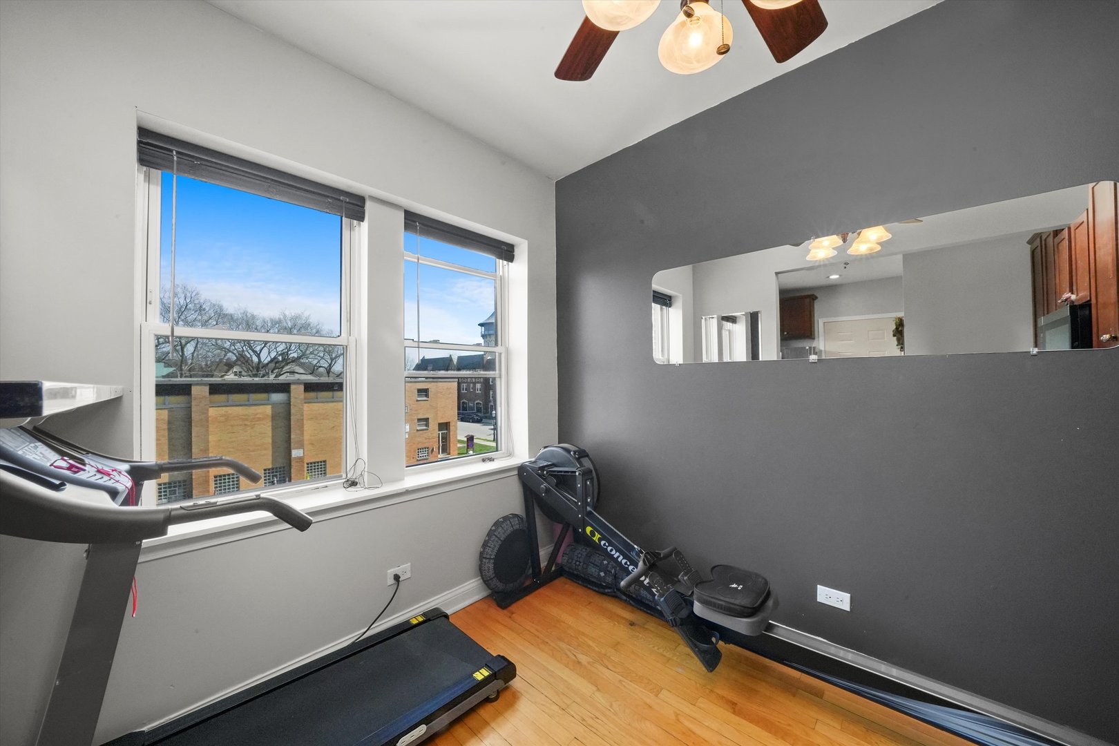 52 Forest Avenue, Unit 2S Riverside, IL 60546 - Photo 13 of 43 a room with gym equipment and a large window