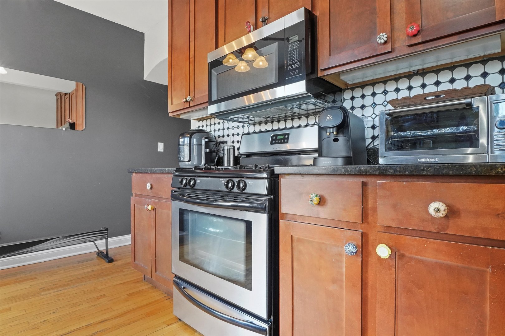 52 Forest Avenue, Unit 2S Riverside, IL 60546 - Photo 22 of 43 a kitchen with stainless steel appliances granite countertop a stove and a microwave