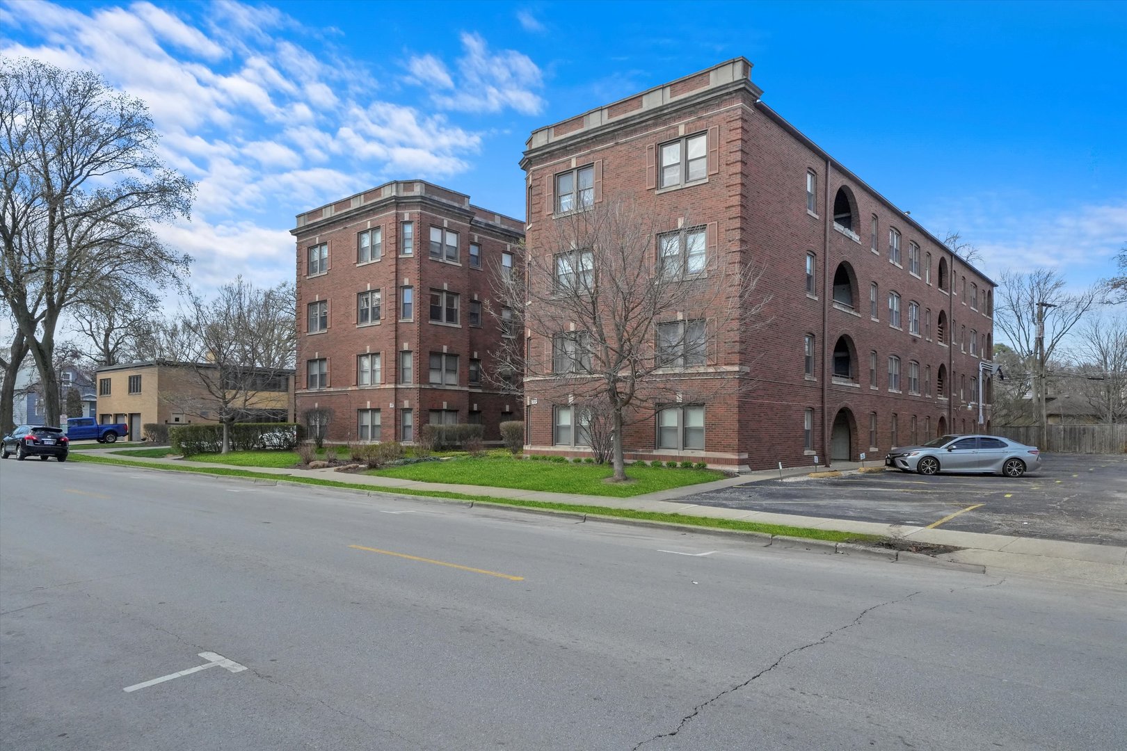 52 Forest Avenue, Unit 2S Riverside, IL 60546 - Photo 27 of 43 a view of a tall building next to a road