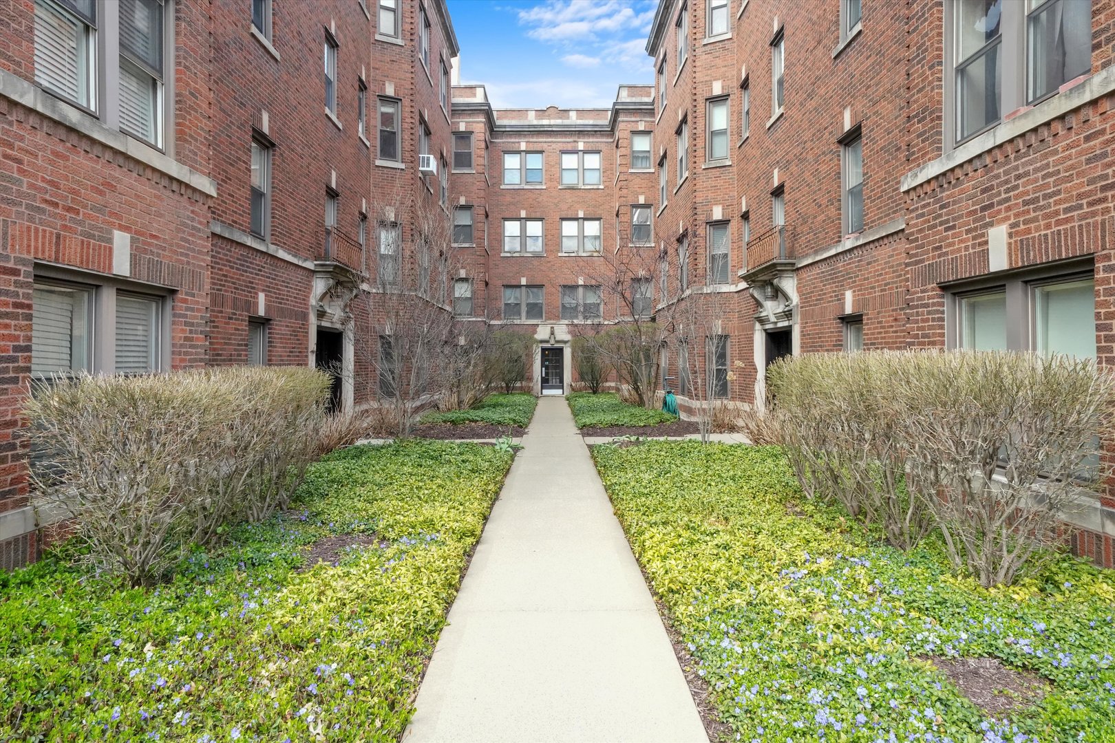 52 Forest Avenue, Unit 2S Riverside, IL 60546 - Photo 29 of 43 a view of a brick building next to a big yard