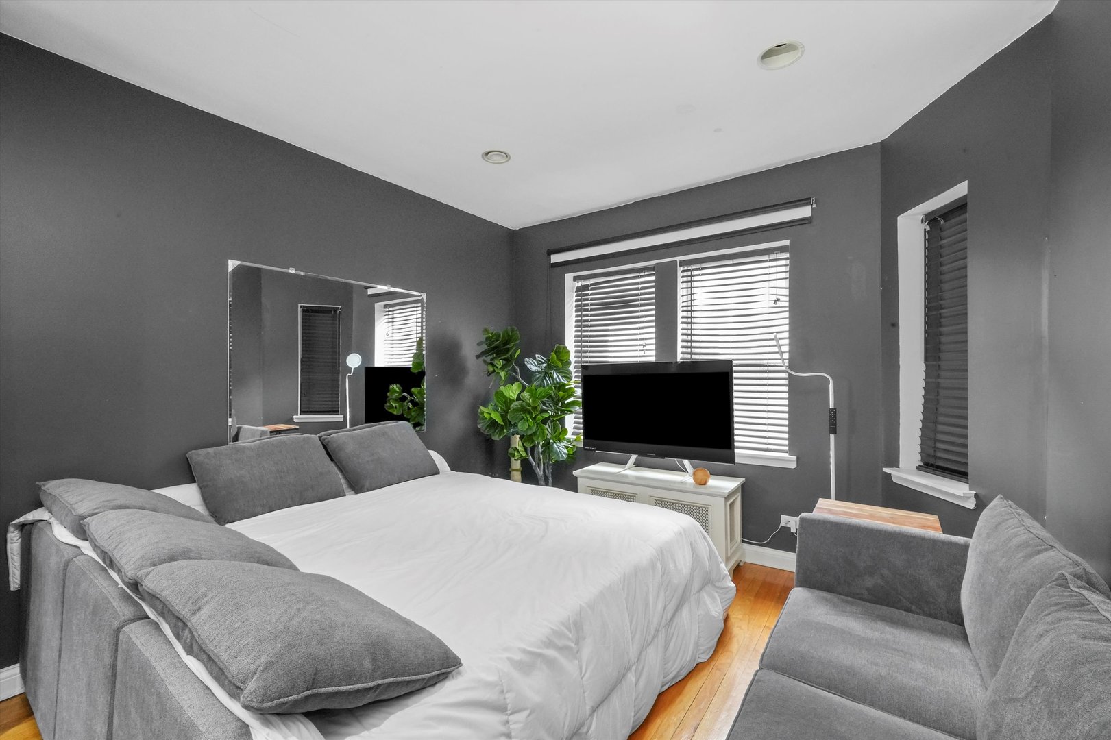 52 Forest Avenue, Unit 2S Riverside, IL 60546 - Photo 4 of 43 a bedroom with a bed and a flat screen tv