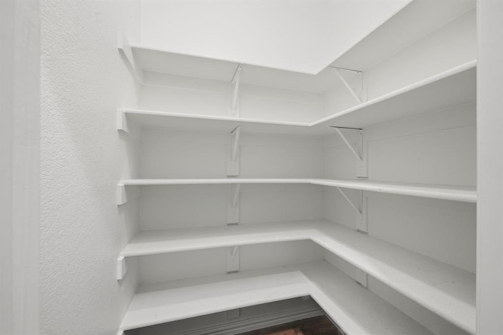 12809 Spring Hill Drive Frisco, TX 75035 - Photo 11 of 37 a view of an empty walk in closet