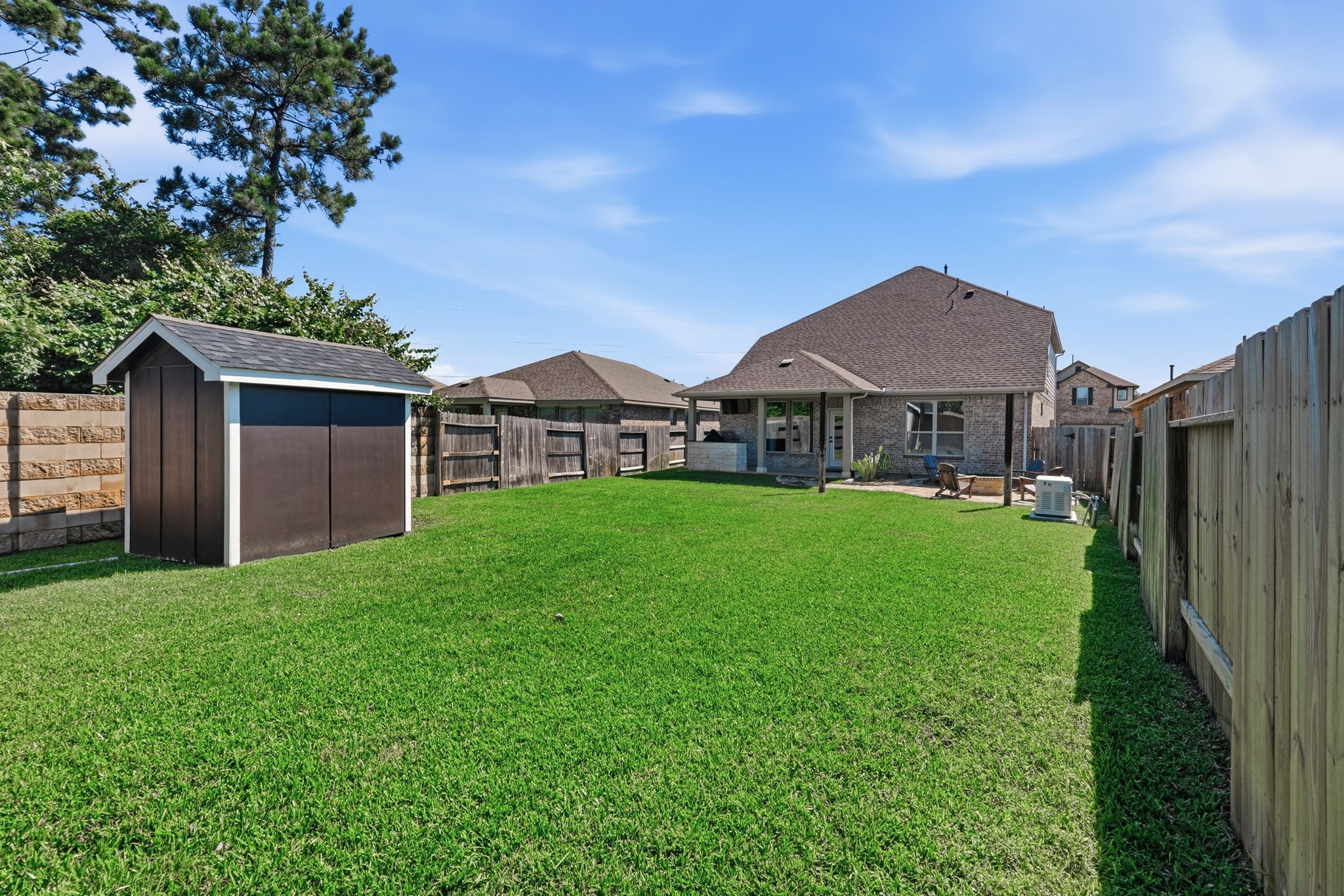 4334 Umber Shadow Drive Spring, TX 77386 - Photo 36 of 45 Spacious backyard offers a large grassy lawn, fenced privacy, and plenty of room for outdoor recreation, pets, or future enhancements.