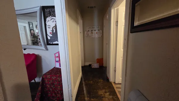 a view of a yard with snow on the road