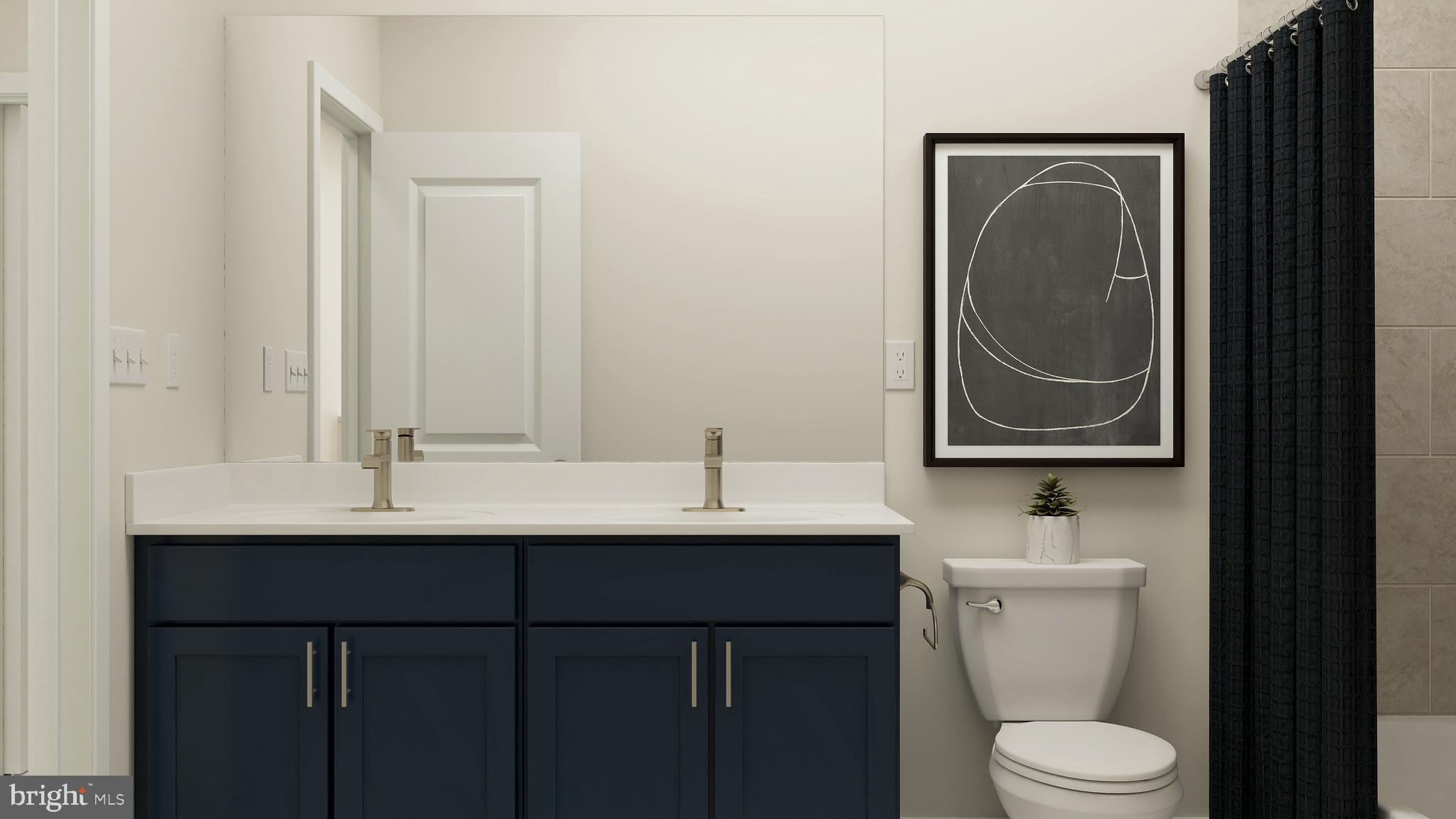 17043 Gathering Street Boyds, MD 20841 - Photo 17 of 29 a bathroom with a toilet a sink and mirror