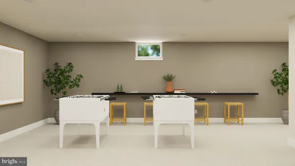 a room with furniture and a potted plant