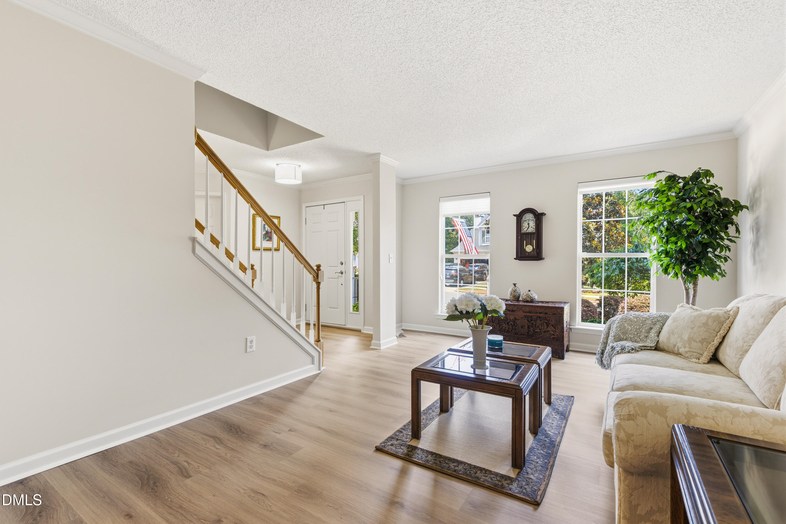1211 Waterford Green Drive Apex, NC 27502 - Photo 13 of 53 a living room with furniture and a wooden floor