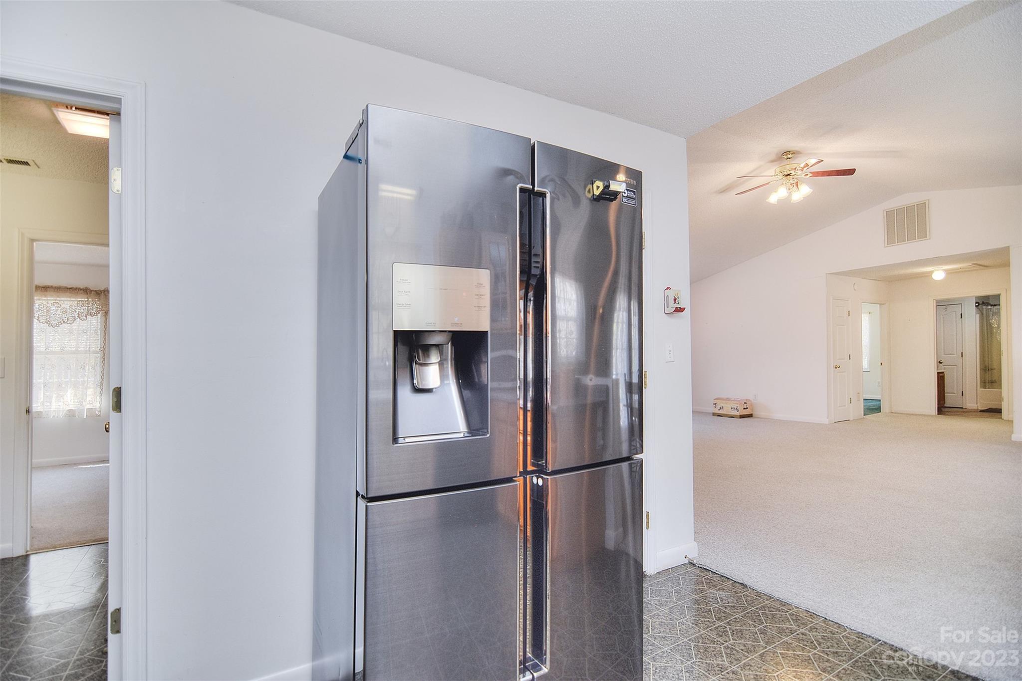 8705 Simpson Road Waxhaw, NC 28173 - Photo 18 of 46 a metallic refrigerator freezer sitting in a kitchen