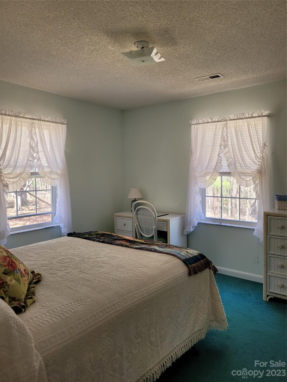 8705 Simpson Road Waxhaw, NC 28173 - Photo 28 of 46 a bedroom with a bed and a window