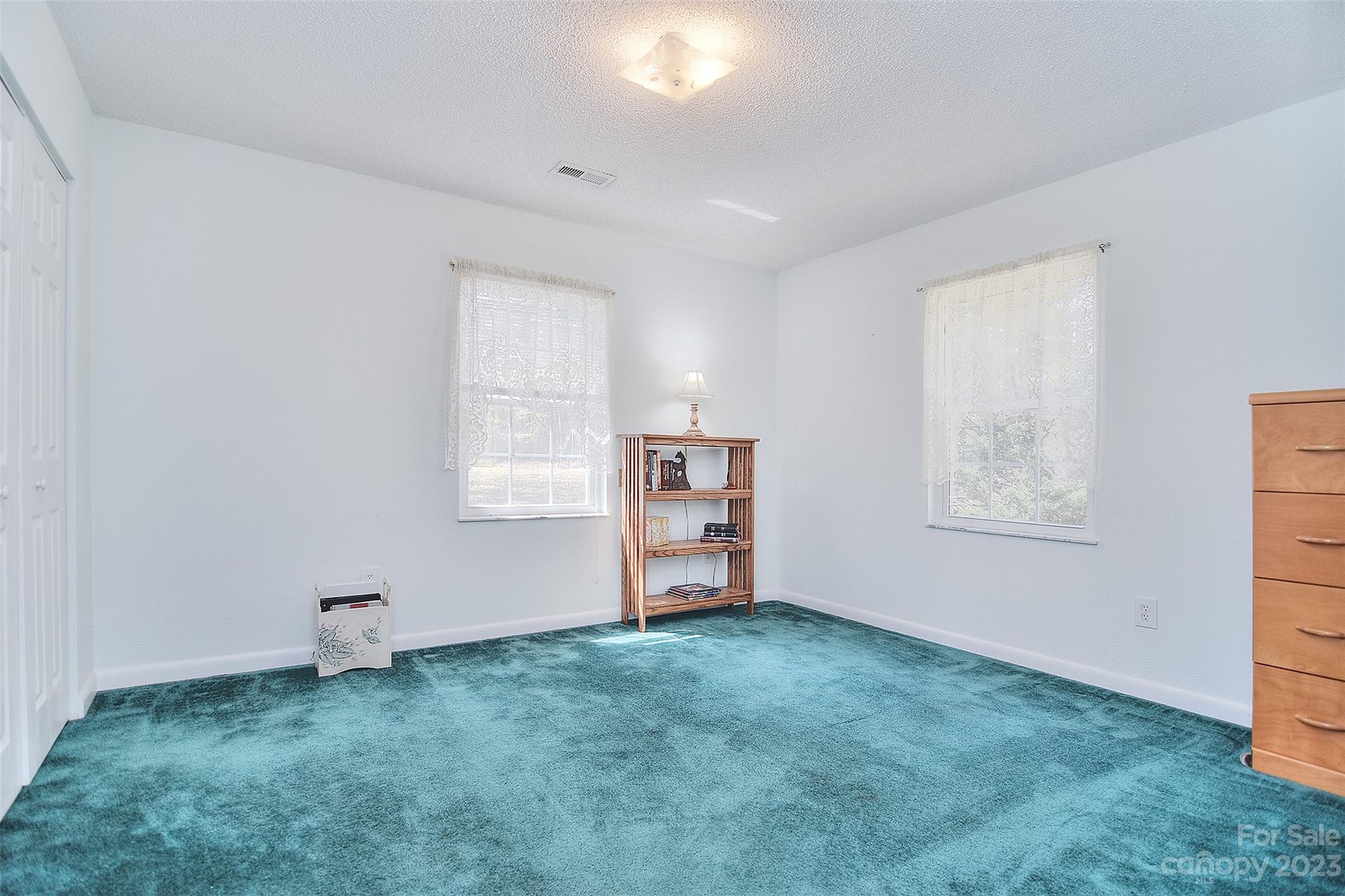 8705 Simpson Road Waxhaw, NC 28173 - Photo 29 of 46 a view of a livingroom with an empty space and a window