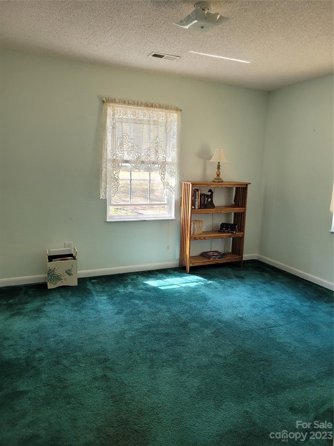 8705 Simpson Road Waxhaw, NC 28173 - Photo 30 of 46 an empty room with windows