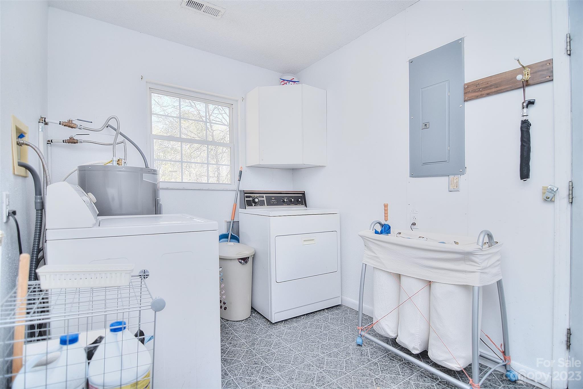 8705 Simpson Road Waxhaw, NC 28173 - Photo 32 of 46 a kitchen with a sink cabinets and window