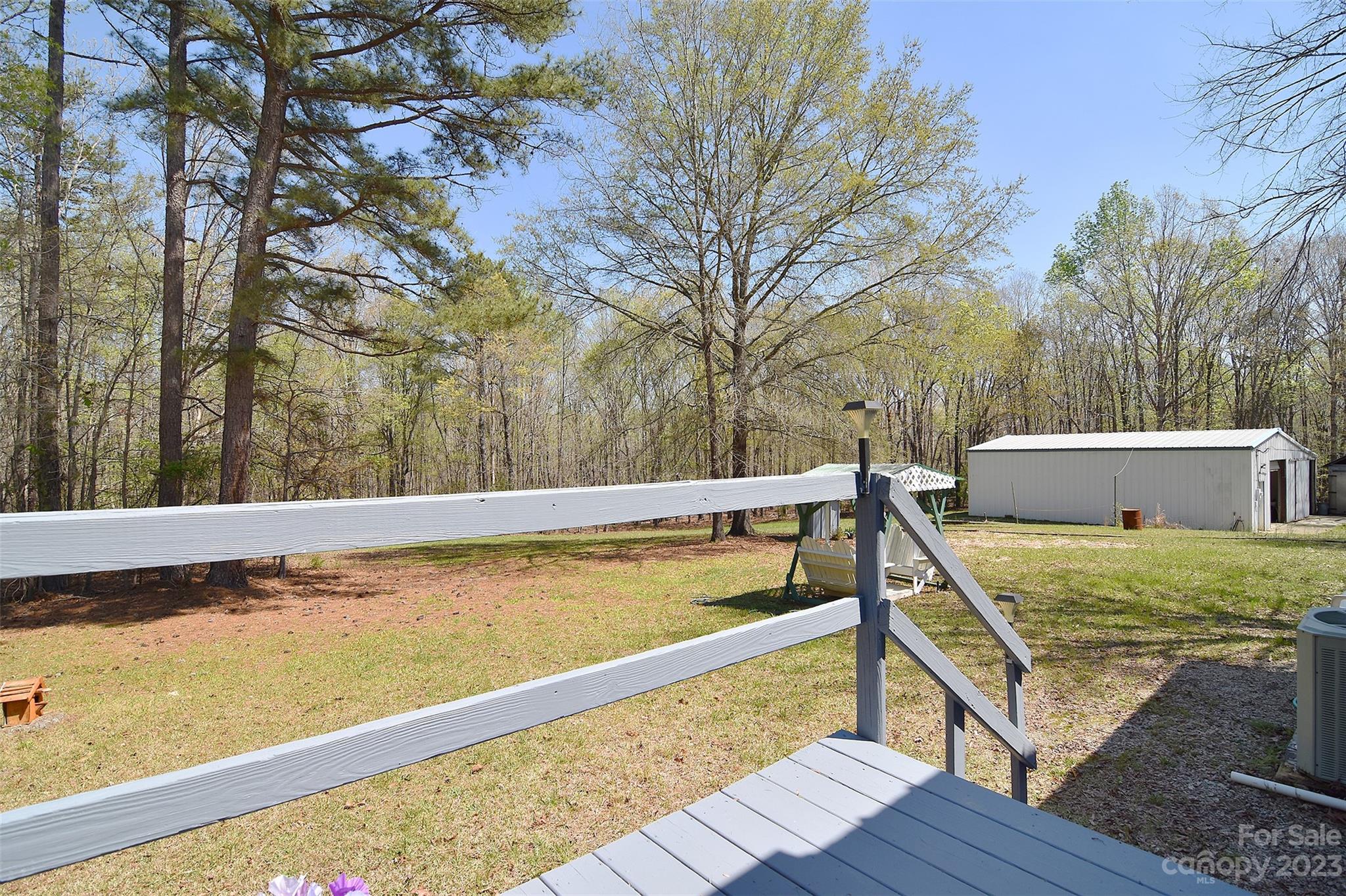 8705 Simpson Road Waxhaw, NC 28173 - Photo 34 of 46 a view of a swimming pool with a patio