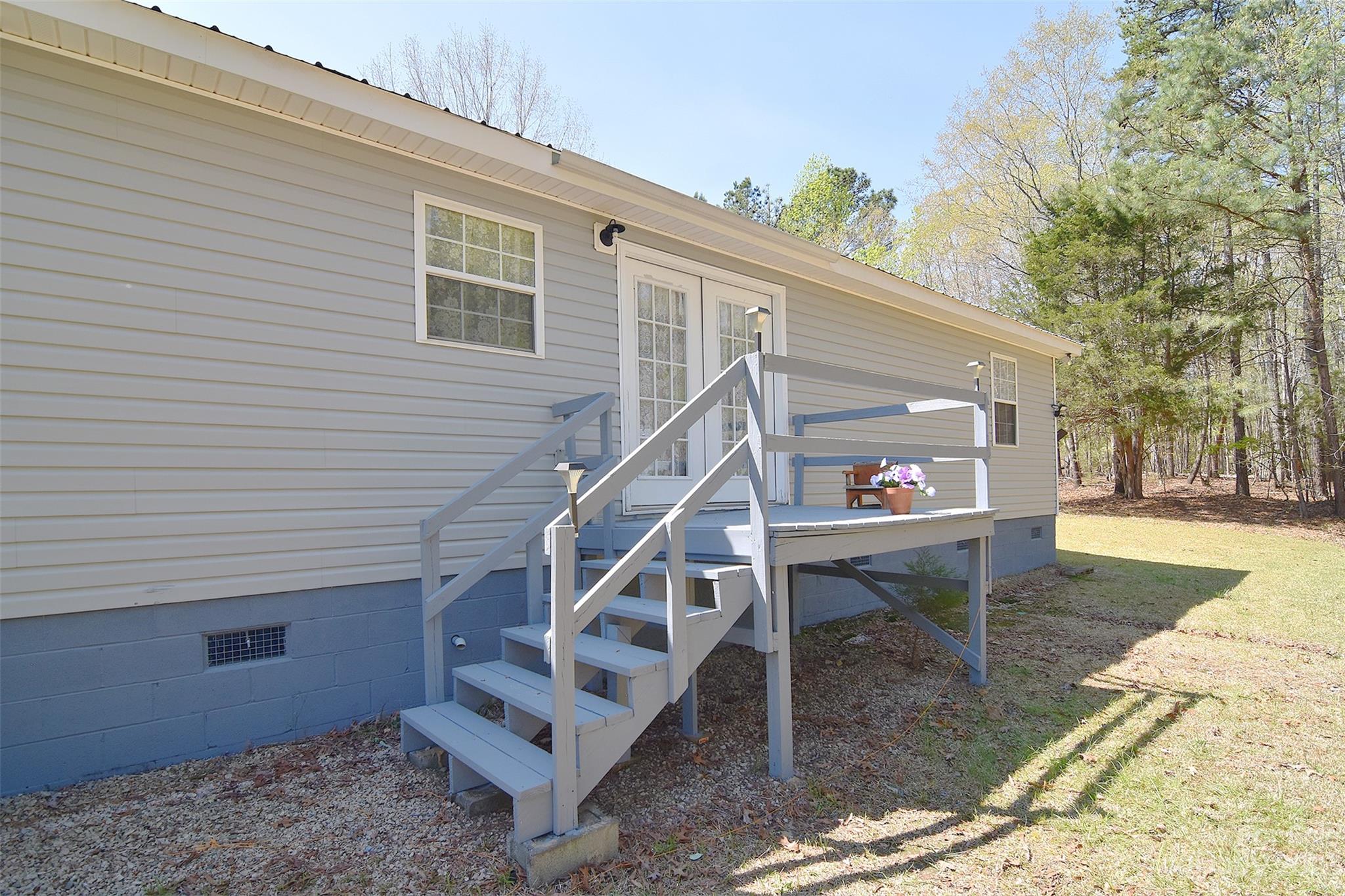 8705 Simpson Road Waxhaw, NC 28173 - Photo 35 of 46 a view of backyard with deck and outdoor seating
