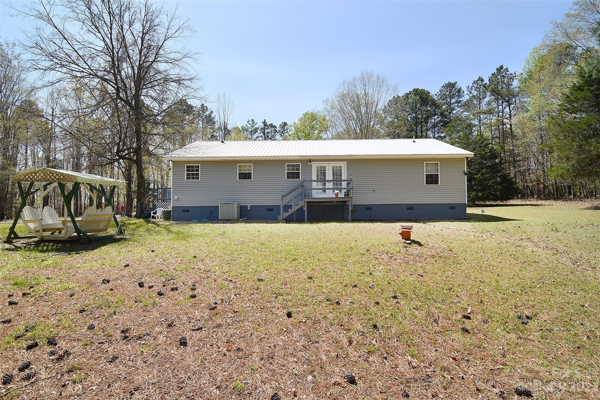 8705 Simpson Road Waxhaw, NC 28173 - Photo 36 of 46 a view of a house with a yard