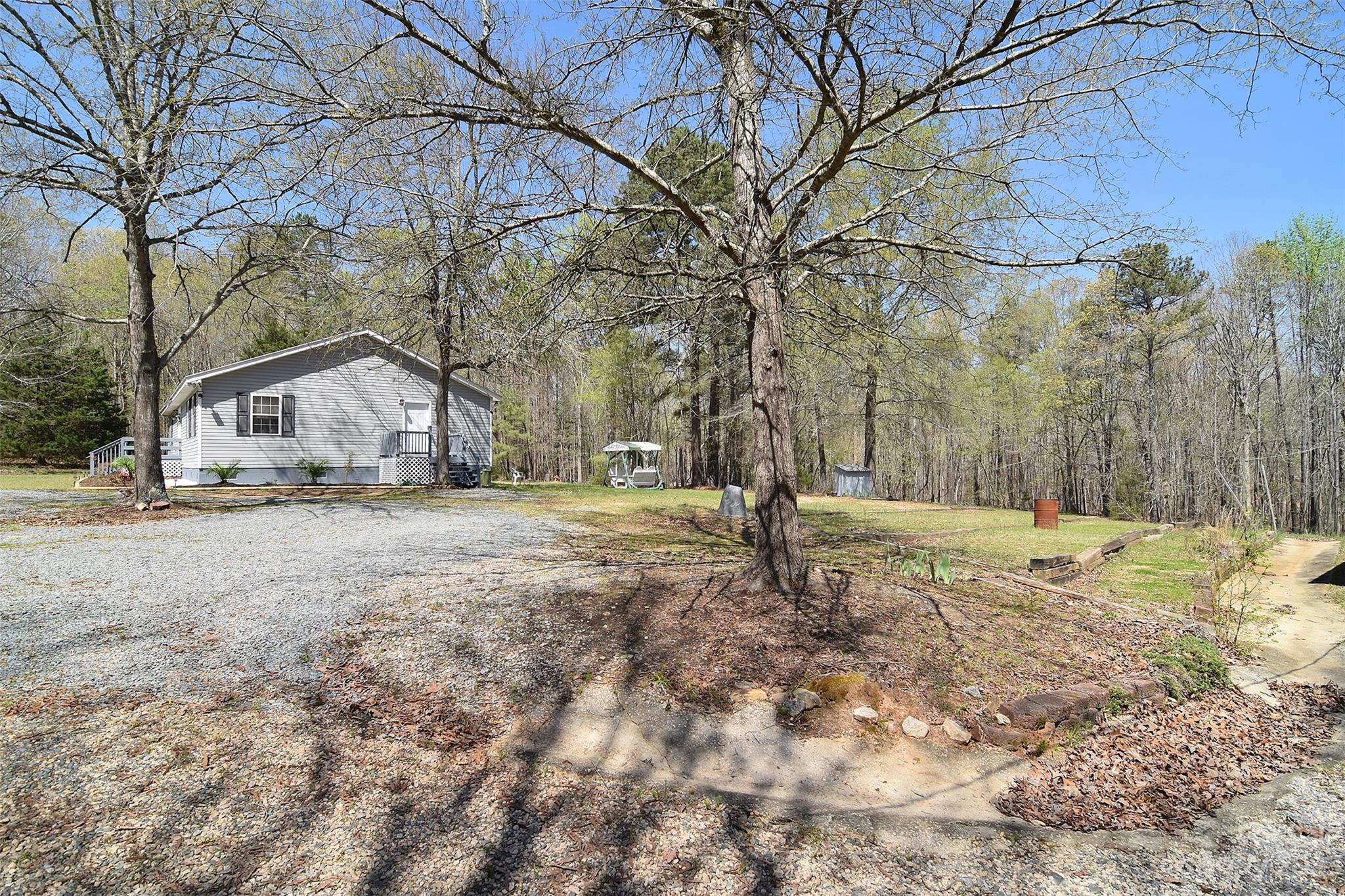 8705 Simpson Road Waxhaw, NC 28173 - Photo 39 of 46 a view of white house with a yard covered with snow