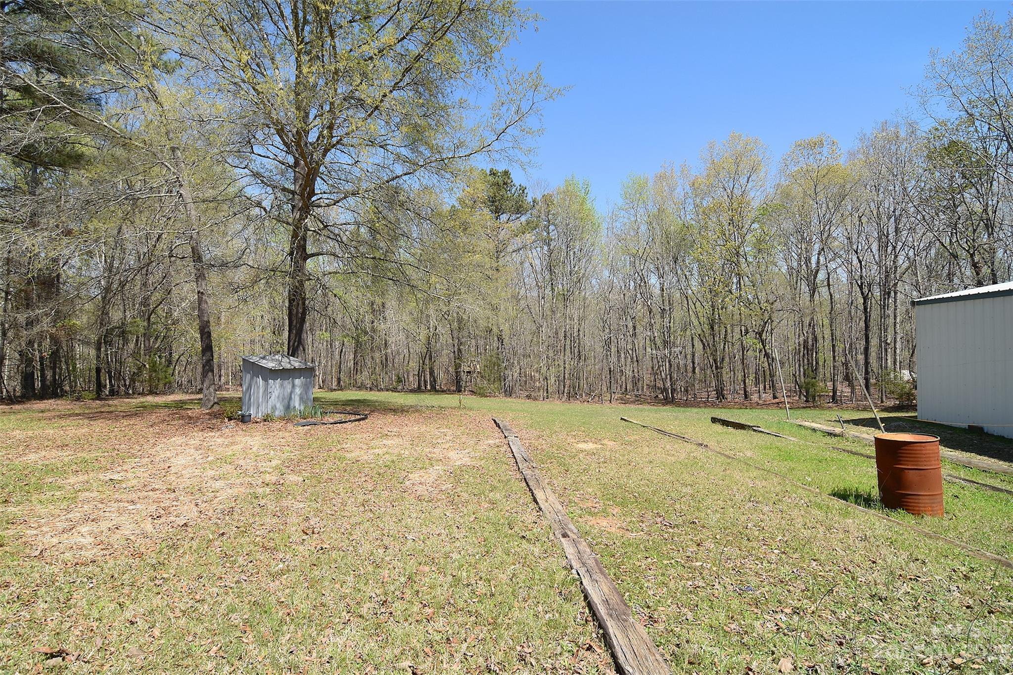 8705 Simpson Road Waxhaw, NC 28173 - Photo 40 of 46 a view of a yard with trees