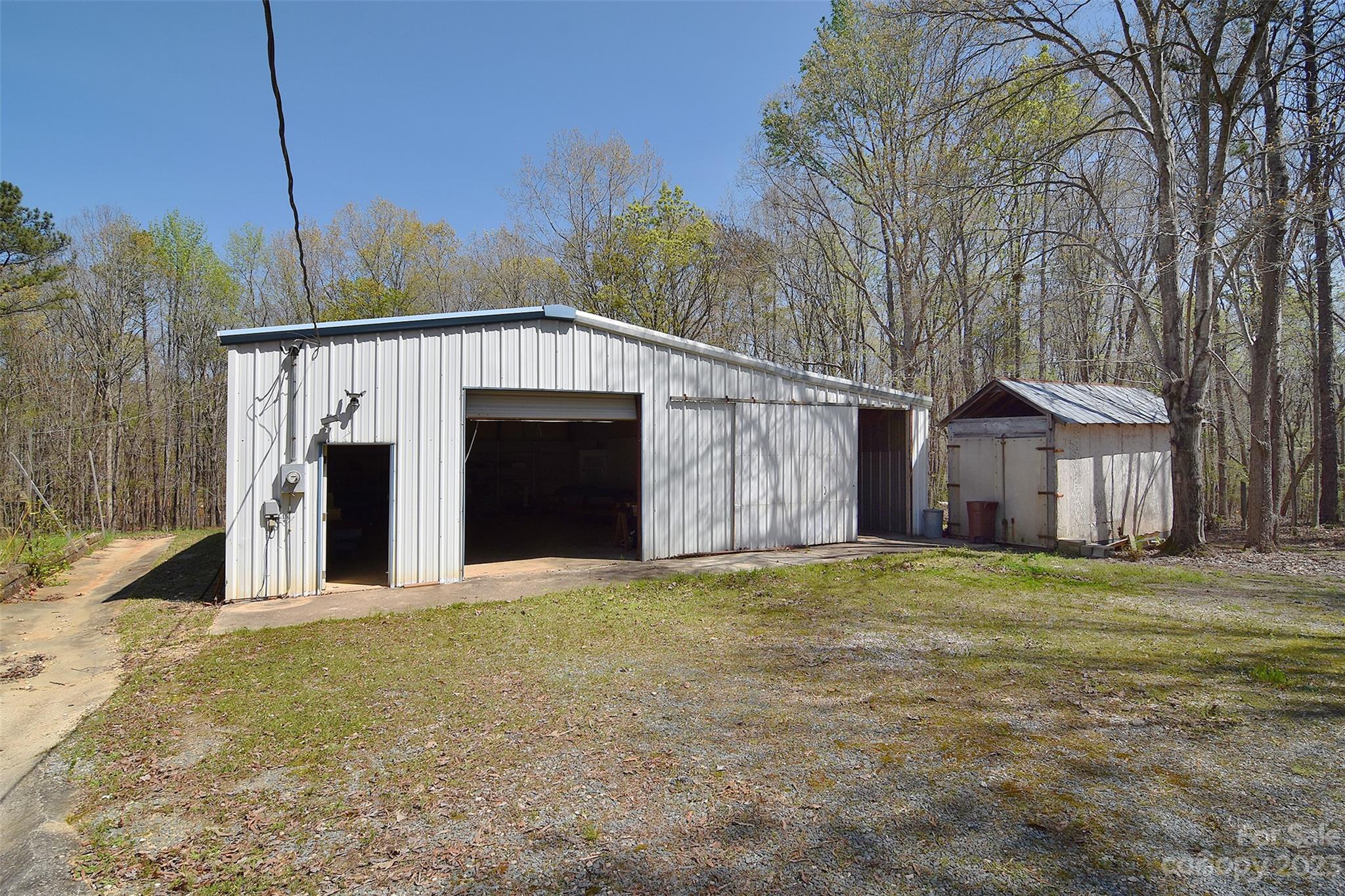8705 Simpson Road Waxhaw, NC 28173 - Photo 41 of 46 a front view of a house with a garden